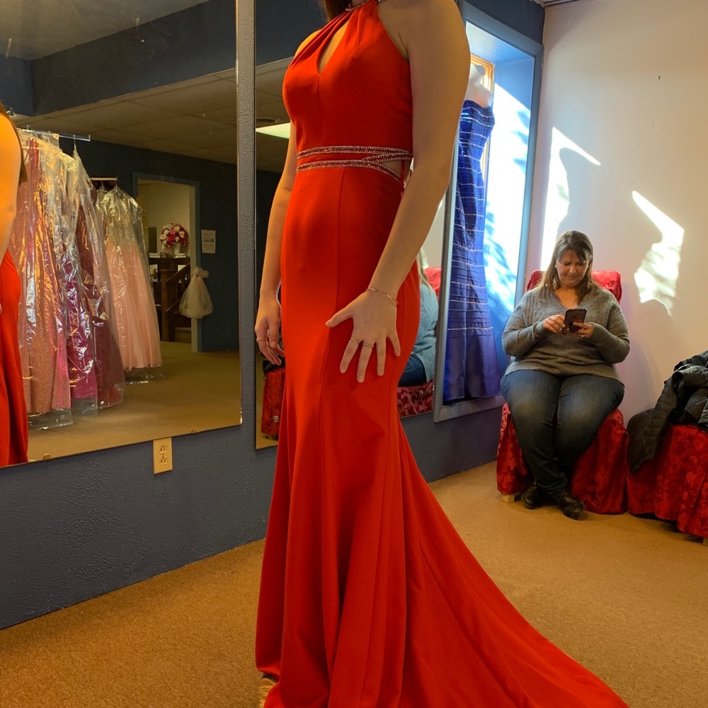 Red abby Paris prom dress with silver detailing.